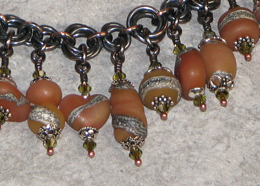 Bracelets/candy_wall_mobius_copper_lampwork_bracelet_carnelian_2.jpg